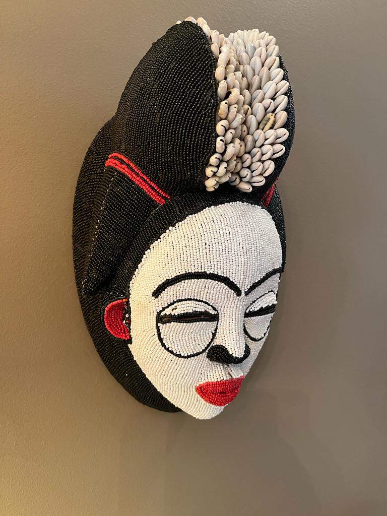Wooden Punu Mask with Beads and Cowrie Shells.