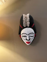 Wooden Punu Mask with Beads and Cowrie Shells.